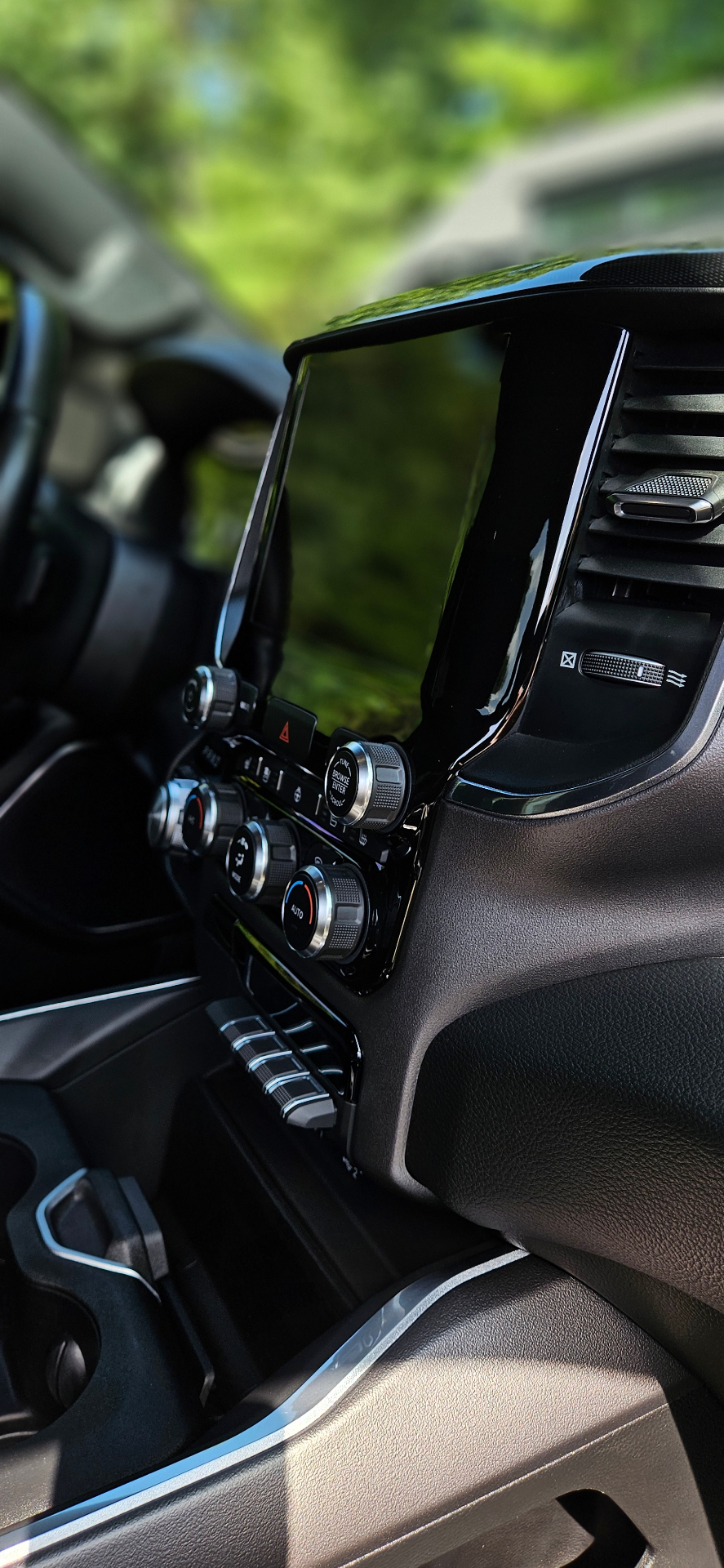 Ram 1500 infotainment screen and piano black trim detail