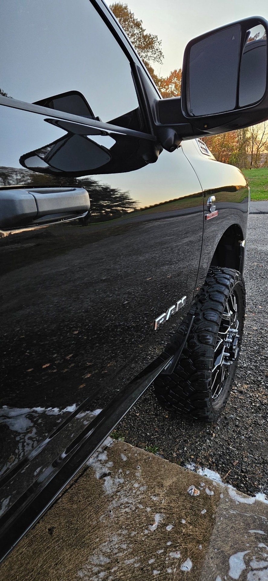 Ram side mirror and glossy black side panel reflection