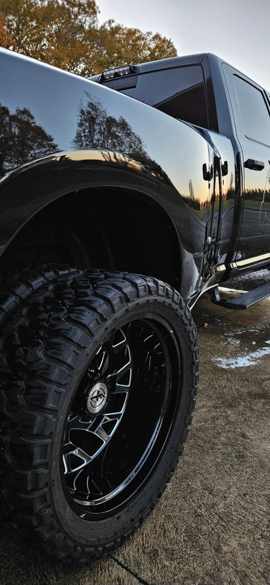 Lifted Ram with detailed wheels at sunset