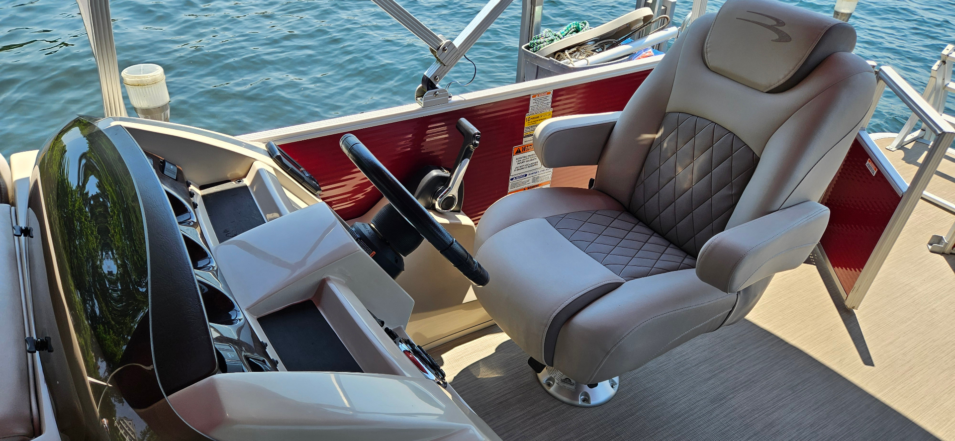 Bennington helm and captain's chair with red hull detail