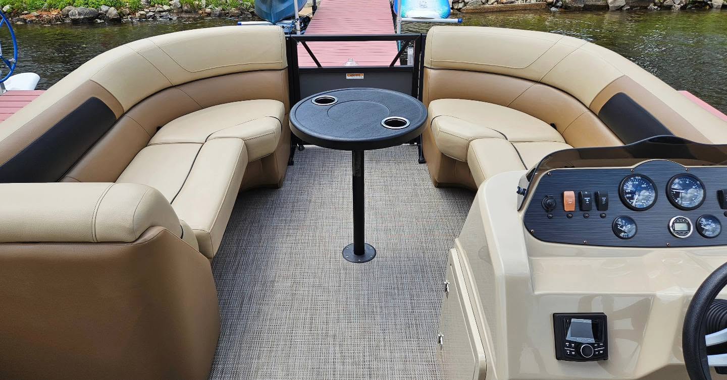 Pontoon wraparound seating and table on the lake