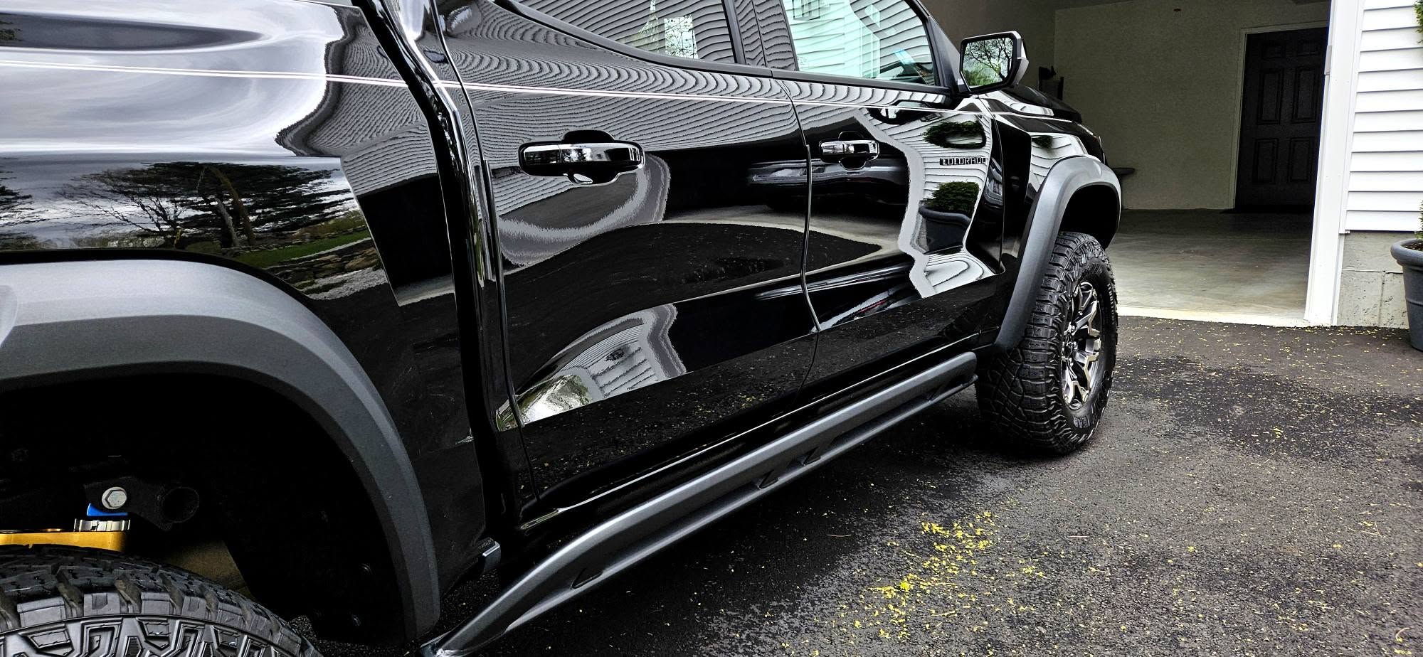 Chevy Colorado glossy black side panels and rocker detail